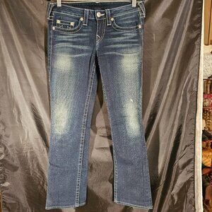 True Religion dark blue with slight fading and white stitching. Size 29